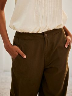 VALUES Handcrafted Organic Fair Minimal Waste CURATOR'S NOTE The Olive Dreams Pant is crafted from twill cotton and features front button opening, side curve pockets, and a back with elasticated waistband for comfort. Its pleated hem adds the perfect finishing touch to any outfit. A must-have for your wardrobe. THE DESIGNER STORY KHARA KAPAS, meaning 'pure cotton' in Hindi, started with the belief that design is a form of expression. True to its name, the brand continuously strives to achieve pu Green Cotton Pants, Cotton Pants, Green Cotton, Pure Cotton, Wellness Design, Printing On Fabric, Size Chart, Pants For Women, Trousers