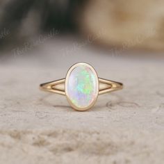 Unique Opal Engagement Ring Solid Gold Rings Art Deco Bezel Set Ring Vintage Oval cut Rainbow Opal Ring Minimalist Wedding Rings For Women ITEM DETAILS ●Available in yellow, white or rose solid 10k, 14k or 18k gold. This ring can be made in Platinum. ❀❀Center Stone: Natural Opal Shape: Oval shape Size: 6x9mm Band width around 1.5mm Visit my shop for more jewelry: https://www.etsy.com/shop/TheRoseCastle if you would like to customize your unique ring, you may contact us about your ideas and pictures. Hope I could get the chance to create fabulous rings for you! ❀Production ---- This ring is handmade and very good quality! Please allow 2-4 weeks for production. It can be made to any ring size.  ❀Engraving service We accept the engraving order, leave a note when placing an order or contact us Opal Ring Bezel Set, Bezel Opal Ring, Opal Gold Necklace, Minimalist Oval Cabochon Opal Ring For Anniversary, Classic Oval Bezel Set Opal Ring, Classic Oval Opal Ring With Bezel Setting, Minimalist Oval Cabochon Wedding Jewelry, Modern 14k Gold Oval Opal Ring, Minimalist Oval Cabochon Wedding Ring