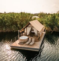 a hot tub sitting on top of a wooden dock