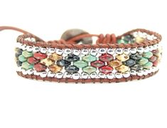 a brown leather bracelet with beads on it