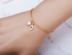 This lovely simplistic bracelet has two metal/color options (silver and gold) and can be personalized with initial and birthstone choices: 1. a small matte white or yellow gold plated leaf charm, stamped with an initial 2. a small freshwater pearl or another birthstone bead of your choice 3. a dainty double strands sterling silver or 14K gold filled chains. 4. an optional personalized jewelry note card, laser printed with your custom message on heavy weight cardstock, in elegant font and layout. Gold Personalized Dainty Pearl Bracelet, Dainty Personalized Gold Pearl Bracelet, Minimalist Personalized Charm Bracelet For Wedding, Personalized Minimalist Charm Bracelet For Wedding, Dainty Personalized Pearl Bracelet As A Gift, Dainty Personalized Pearl Bracelet As Gift, Dainty Personalized Pearl Bracelet, Spring Wedding Jewelry, Marriage Jewellery