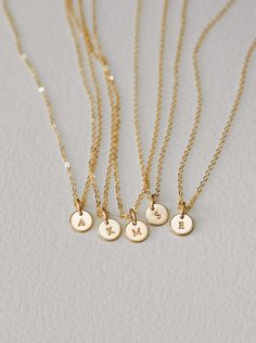 Tell a tiny story and make it all about Yue. This personalized necklace is a GLDN staple (and for good reason)! Personalize with special initials or one of over 30 symbols—the perfect anniversary gift, birthday gift or milestone gift. Each piece is hand-personalized in our studio with traditional metal punches, and available in top-quality 14k gold fill, sterling silver, rose gold fill and 14k solid gold. Another reason to love this piece: you can add extra disks as your story grows! Dainty 14k Gold Filled Engraved Charm Necklaces, Minimalist 14k Gold Filled Necklace For Personalized Gift, Dainty Engraved 14k Gold Filled Charm Necklaces, Dainty 14k Gold Filled Engraved Charm Necklace, 14k Gold Initial Pendant Name Necklace For Anniversary, Customizable 14k Gold Anniversary Necklaces, Classic Customizable Initial Pendant Necklace, 14k Gold Personalized Charm Necklace, Personalized 14k Gold Charm Necklace