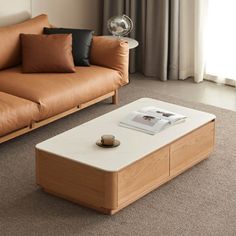 a living room with two couches and a coffee table in front of a window