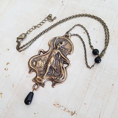 "Beautiful detailed Art Nouveau style antiqued brass Valkyrie pendant is suspended from an antique bronze chain, with decorative jet black glass beads. Choose your length in inches from the drop down menu. In Norse mythology, a Valkyrie (\"chooser of the slain\") guides the souls of deceased Nordic soldiers in one of two paths. Selecting among half of those who die in battle go to Fólkvangr, Freyja's afterlife, the other half go to Odin's hall called Valhalla. There, the deceased warriors become Two Paths, Norse Goddess, Detailed Art, Peace Sign Necklace, Art Nouveau Pendant, Goddess Necklace, Vintage Lady, Norse Mythology, Black Glass