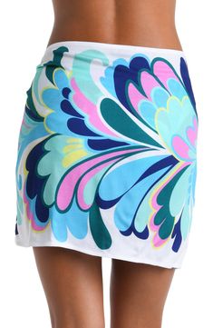 The print on this short pareo cover up features a bold and dynamic floral pattern with large, stylized petals in shades of blue, green, pink, and yellow, creating a modern and exuberant effect. The design has a flowing, organic quality to it, giving the impression of movement and radiance. The one-size-fits-all design provides a custom fit, and the side tie keeps everything undercover. [split] Details Short pareo cover up Adjustable wrap tie Tassel trim One size fits all Fabric 100% Rayon Crepe White Floral Print Sarong For Beach Season, Multicolor Tropical Print Sarong For Poolside, Multicolor Tropical Print Beachy Sarong, Beachy Multicolor Sarong With Tropical Print, White Floral Print Beachwear Sarong, Beachy Multicolor Tropical Print Sarong, Tropical Multicolor Sarong For Poolside, Green Printed Sarong For Spring, Multicolor Tropical Print Sarong For Pool