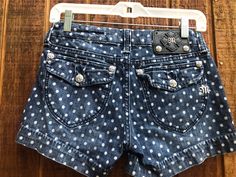 "Size 27 Miss Me polka dot denim shorts. Measurements taken across front laid flat 14.5\" across front of low rise waist 18\" across front of hips 8\" rise 3\" inseam" Thrift Inspo, Fashion Angels, Denim Shirt With Jeans, Polka Dot Shorts, Embellished Top, Embroidered Denim, Vintage Shorts, Miss Me Jeans, Skorts