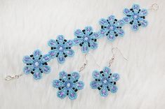 This beautiful and coquettish light blue flower bracelet&earrings set will keep you in good mood for all day long. Lenght of the bracelet is 18 cm, lenght of the earrings is 5.5 cm. It is so feminine and springlike! It can be an excellent gift. Light Blue Beaded Flower Jewelry, Light Blue Flower-shaped Beaded Jewelry, Light Blue Flower-shaped Jewelry With Matching Earrings, Blue Flower Bracelet, Light Blue Flowers, Snake Jewelry, Rainbow Earrings, Gold Necklace Women, Seed Bead Necklace