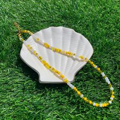 This yellow seed bead necklace is part of our spring collection! These colors are sure to give you a reminder of ice-cold lemonade! This necklace is a personal favorite! Hope you enjoy this piece as much as we do! Casual Yellow Round Bead Necklaces, Casual Yellow Beaded Necklaces With Round Beads, Spring Beach Beaded Necklaces With Round Beads, Tiny Yellow Beads For Summer, Yellow Necklaces With Round Letter Beads, Yellow Necklace With Letter Beads, Yellow Necklaces With Letter And Round Beads, Yellow Necklaces With Colorful Beads For Summer, Yellow Round Beads Necklace For Summer