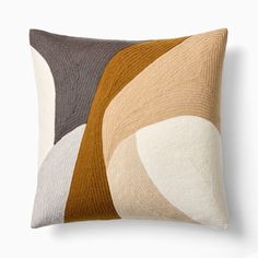 a pillow with different colored shapes on it