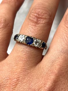 Gorgeous Art Deco French 18k Gold Engraved Sapphire & Diamond Ring with natural Sapphires and old mine Diamonds. This treasure was acquired in France, it has gorgeous engraving all around it and on both sides. The stones are beautiful and sparkling, a very fine quality and example from the Art Deco era. It is hallmarked with the French eagle's head (for 18k gold purity).  US size: 6 3/4 (it can be resized upon request) Weight: 4.8 grams Excellent antique conditions. Thank you for visiting Boudoi Antique Sapphire Diamond Ring, Antique Sapphire Ring For Wedding, Antique Style Sapphire Ring For Weddings, Heirloom Sapphire Diamond Ring With Single Cut Diamonds, Hallmarked Sapphire Ring With Diamond In Round Cut, Heirloom Sapphire Birthstone Ring, Vintage Round Three Stone Sapphire Ring, Vintage Round Sapphire Ring With Three Stones, Oval Sapphire Jewelry With Single Cut Diamonds