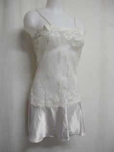 "Short White Lace and Satin Nightgown Unbelievably adorable! Sheer Baby doll /white nightie! Tons of lace with a satin flouncy skirt This is sassy! (Like You!) Small 36\" bodice 40\" Hip 32\" length Easy care poly GREAT for brides! https://www.etsy.com/shop/BelindasStyleShop" White Lace Nightgown For Wedding, White Lace Wedding Nightgown, Coquette Lace Slip Dress For Night, Cream Lace Wedding Nightgown, Wedding Cream Lace Nightgown, Fitted Delicate Lace Nightgown For Sleep, Sheer Lace Slip Dress For Sleep, White Lace Fitted Nightgown, Fitted White Lace Nightgown