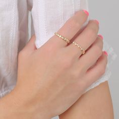 Make a sparkly statement with our Bezel eternity ring set with round grade 5A CZ's. It has the wow factor to be worn alone or stacked with our other rings. - Made in gold vermeil: a thick 18k gold layer on sterling silver.- Band thickness: 3.2 mm.- Shower safe, tarnish resistant & hypoallergenic Ring Size Chart. If you are in between sizes, we recommend sizing up. Stackable Yellow Gold Midi Rings With Cubic Zirconia, Stackable Cubic Zirconia Midi Rings In Yellow Gold, Yellow Gold Stackable Midi Rings With Cubic Zirconia, Everyday Diamond White Half Eternity Rings, Yellow Gold Cubic Zirconia Midi Rings, Gold Stackable Diamond Crystal Ring, Gold Diamond Stackable Crystal Ring, Stackable Gold Crystal Ring With Diamonds, Cubic Zirconia Stackable Rings With Bezel Setting For Promise