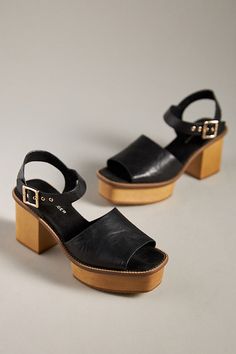 Leather upper Microsuede insole Wood heel Rubber sole Buckle styling Imported | Groove Platform Sandals by Kelsi Dagger Brooklyn in Black, Women's, Size: 8.5, Leather/Rubber/Suede at Anthropologie Chic Clogs With Ankle Strap And Removable Insole, Chic Ankle Strap Clogs With Removable Insole, Summer Suede Clogs With Buckle Closure, Chic Clogs With Heel Loop And Ankle Strap, Chic Closed Toe Sandals With Wooden Heel, Summer Suede Mules With Heel Strap, Summer Suede Heels With Leather Sole, Chic Open Toe Clogs With Leather Sole, Summer Suede Mules With Heel Loop