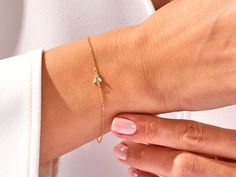 A luxurious addition to any ensemble, this Diamond Bee Bracelet in 14k Gold exudes glamour and sophistication. Featuring a 14k Gold setting and a shimmering Diamond Bee charm, this is the perfect piece for those with a taste for high-end fashion. Features• Made to Order• Gold Kt: 14K• Gold Color: Rose Gold, Yellow Gold, White Gold• Gem Stone: Natural White Diamonds• Diamond Cut: Marquise• Number of Stones: 2• Available Stone Sizes: 2 x 1.50 x 3.00 mm• Total CTW: 0.05 ct• Diamond Color - Clarity: Bee Bracelet, Bee Charms, Gem Stone, Diamond Color, Gold Set, High End Fashion, White Diamonds, Gold Yellow, Diamond Cut