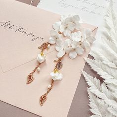 Dainty Silk Flower Earrings With Gold Leaves and Pearls - Etsy Poland White Dangle Bridal Earrings, White Wedding Jewelry With Flower Decoration, White Flower Decoration Wedding Jewelry, Elegant Handmade Flower Bridal Earrings, Gold 3d Flowers Jewelry For Wedding, Elegant Bridal Flower Earrings With Handmade Flowers, Gold Jewelry With 3d Flowers For Wedding, Elegant Bridal Earrings With Handmade Gold Flowers, Delicate Flower Bridal Earrings For Bridesmaid Gift