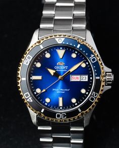 The way the shimmering blue plays off the gold accents is something to behold. Timeless Blue Watches For Anniversary, Classic Blue Watch Accessories For Anniversary, Blue Watches With Subdials For Anniversary, Blue Anniversary Watches With Subdials, Blue Anniversary Watch With Subdials, Orient Watch, Diving Watch, Diver Watch, Bracelet Clasps