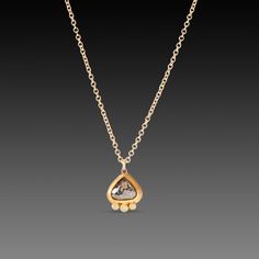 This diminutive but magical salt and pepper diamond teardrop is wrapped in warm 22k gold and accented with a trio of sparkling white diamonds. Hangs on a delicate 14k gold chain. Pendant measures approximately 5/16 inch tall. Matte finish. Teardrop Rose Cut Diamond Necklaces For Gifts, Gold Drop Jewelry With Rose Cut Diamonds, Gold Drop Necklace With Single Cut Diamonds, Luxury Teardrop Pendant Necklace With Diamond Accents, Teardrop Diamond Necklace With Rose Cut Diamonds For Anniversary, Gold Diamond Necklace With Single Cut Teardrop Diamonds, Gift Rose Cut Diamond Teardrop Necklaces, Rose Cut Diamond Teardrop Necklace As Gift, Gold Diamond Teardrop Pendant Necklace