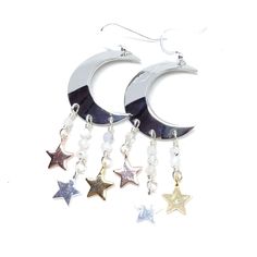 You were born with the imprint of the moon and stars on your soul. Show your ties to the ethereal night sky with these sparkling moon and star earrings! These earrings dangle 2 3/4". Sterling silver ear wires, rhodium plated moons, moonstones. To keep these moon and stars bright and shiny, I recommend a Sunshine Polishing Cloth! Celestial White Sterling Silver Earrings, White Sterling Silver Celestial Earrings, Silver Moon Shaped Jewelry With Ear Wire, Nickel-free Moonstone Moon Earrings, Celestial Sterling Silver Earrings, Nickel-free Moonstone Moon-shaped Earrings, Handmade Silver Cosmic Jewelry, Celestial Crescent Silver Earrings, Celestial Moonstone Earrings With Moon Phase