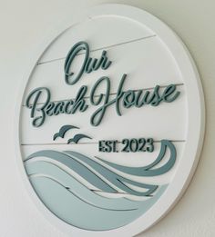 a sign that reads our beach house est 2095