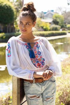 Do you need a little bit of boho flair and style? If so, then look no further than the Elena tunic; a long-sleeved off shoulder top with glamorous floral print and embroidery is the perfect addition to your wardrobe. The wide neck fit features pom pom tassels Embroidered Off Shoulder Top Long Sleeves, 100% Cotton, One Size, Model is: Height: 5"6 Bust: 34B Waist: 27" Color Natural Made in India Sabrina Neckline, Floral Prom Dresses, Boho Summer Outfits, Bohemian Tops, Off Shoulder Crop Top, Boho Fall, Embroidered Tunic, Off Shoulder Top, Shoulder Crop Top