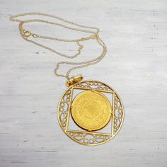 Product Details: Coin Material: 22K Solid Yellow Gold Coin Diameter: 22 mm Coin Thickness: 1.52 mm Coin Purity: 91.67% Chain Material: 14K Solid Yellow Gold Chain Length: 16 Inches Weight: 0.82 Grams Necklace Style: Rope Chain Closure Style: Spring Ring Only ships within United States Coin, Bezel and Chain Features: Total Weight: 14.62 Grams (Gold) Handmade item Bezel Material: 22K Solid Yellow Gold Bezel Size: 1.5 Inch 22k Yellow Gold Medallion Jewelry, Vintage 22k Gold Engraved Jewelry, Yellow Gold Amulet Coin Necklace As Gift, Yellow Gold Plated Round Coin Necklace, Yellow Gold Plated Coin Necklace With Round Shape, 22k Yellow Gold Amulet Jewelry, 22k Gold Filigree Round Jewelry, 22k Gold Filigree Jewelry, Antique 22k Gold Pendant Jewelry