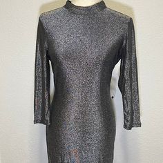 Never Worn. Still Have Tag With Extra Button On It. Sexy Bodycon Dark Silver Mock Neck Dress With Long Sleeves And Open Back. Great For A Party Or Night Out. Button Closure In Back Size Medium Long Sleeve Party Mock Neck Open Back Metallic Shiny Glitter Sparkle Sparkly Club Rave Y2k Stretch Sexy Metallic Long Sleeve Mini Dress For Fall, Metallic Long Sleeve Mini Dress With Sequins, Metallic Long Sleeve Sequin Mini Dress, Silver Mini Dress For Fall, Shiny Long Sleeve Mini Dress For Party, Metallic Long Sleeve Shiny Dress, Metallic Fitted Mini Dress For Holiday, Metallic Shiny Long Sleeve Dresses, Silver Bodycon Mini Dress For Night Out