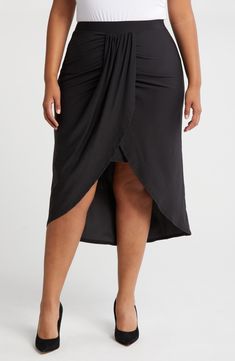 Soft, stretchy jersey adds a comfortable touch to this curve-hugging wrap skirt designed with an elegant draped design at the front. Elastic waist Lined 95% rayon, 5% spandex Machine wash, tumble dry Imported Black Flowy Draped Skirt, Black Draped Flowy Skirt, Black Draped Ruched Bottoms, Ruched Draped Flowy Skirt, Draped Flowy Ruched Bottoms, Draped Lined Skirt, Relaxed Ruched Draped Skirt, Relaxed Draped Skirt For Party, Night Out Draped Skirt With Ruched Sides