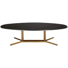 an oval table with gold legs and black top