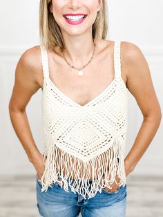 Be a boho babe with our Crochet Cropped Bustier Tank Top! This playful piece features delicate crochet and sassy fringe, perfect for any festival or beach day. Keep it cool and carefree with this quirky and stylish top. Fabric content: 100% Acrylic Crochet Lace Top For Festival Beachwear, Summer Festival Crochet Lace Top, Bohemian Crochet Lace Top For Beach Party, Hippie Sleeveless Crochet Top For Beach, Bohemian Crochet Top For Summer Music Festival, Sleeveless Fringe Top For Beach Season, Beachy Crochet Top For Summer Festivals, Beachy Crochet Top For Festival, Bohemian Crochet Top For Beach Party