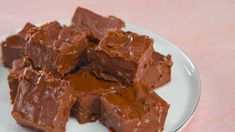 a white plate topped with pieces of chocolate fudge