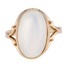 Glowing translucent 9.00 carat oval moonstone center stone in a 14k yellow gold setting. Circa 1940 1 oval cabochon clear white moonstone, VS approx. 9.00cts Size 6 and sizable 14k yellow gold 4.7 grams Width at top: 16.8mm Height at top: 10.2mm Width at bottom: 2.2mm Timeless Oval Rings With High Luster, Classic Opal Jewelry With Polished Finish, Classic Moonstone Cabochon Ring For Anniversary, Classic Cabochon Opal Ring For Formal Occasions, Classic Oval Opal Ring With Polished Finish, Oval Cabochon Opal Ring With Polished Finish, Heirloom Oval Opal Ring For Formal Occasions, Classic Round Cabochon Moonstone Ring, Oval Cabochon Opal Ring In Fine Jewelry