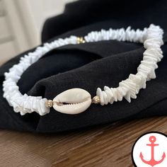 White Surf Necklace: Ride the Waves with Style Indulge your passion for the sea with our exquisite White Surf Necklace. Designed for the avid sea lover, this necklace is a stunning addition to our Surfer Necklace collection, capturing the essence of the ocean in its intricate design. Features of White Surf Necklace based on the Product Content High-Quality Materials: The White Surf Necklace is crafted with precision using premium materials, ensuring durability and long-lasting beauty. Elegant De White Shell-shaped Necklace For Gift, White Shell-shaped Necklace For A Gift, Elegant White Strand Shell, White Strand Shell Necklace Gift, White Strand Shell Necklace As Gift, White Strand Shell As Gift, White Shell Strand Necklace For Gift, Elegant White Shell For Beach, White Shell Jewelry With Ocean-inspired Style