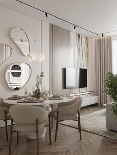 an elegant dining room with white walls and wood flooring, round table surrounded by beige upholstered chairs