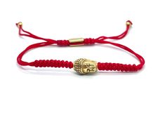 "This red braided bracelet is an everyday wear jewelry. Symbolizes luck, good fortune and protection. The red nylon cord is strong and it will not fade with water, the Buddha charm is made of stainless steel gold toned, and it will not tarnish or fade with water.  This bracelet is one of my favorite bracelets because it is confortable and durable, it can be combined with any other jewelry and it will keep that delicate look at all times.  Nylon cord 1.5 mm double row, this bracelet is adjustable Adjustable Braided Red Jewelry, Adjustable Red Braided Nylon Cord Bracelet, Red Braided Jewelry As A Gift, Adjustable Red Nylon Cord Bracelet, Red Braided Jewelry Perfect As A Gift, Adjustable Red Braided Nylon Bracelet, Red Braided Jewelry For Gifts, Adjustable Red Nylon Cord Braided Bracelet, Adjustable Red Braided Bracelets For Good Luck