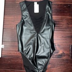 Black Leather Bodysuit. Never Worn. Size Medium Edgy Bodysuit For Spring Night Out, Edgy Bodysuit For Night Out In Spring, Edgy Sleeveless Bodysuit For Party, Edgy Sleeveless Party Bodysuit, Trendy Lined Bodysuit For Night Out, Trendy Bodysuit With Lined Body For Night Out, Sleek Black Bodysuit For Spring, Edgy Sleeveless Bodysuit For Night Out, Sleek Bodysuit For Night Out In Spring