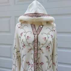 Nwt Size Xl Lucia-Burns Hooded Cardigan Sweater, Embroidered Floral Design On Ivory Knit, Fur Trim On Sleeves & Hood. Ribbon Trim On Sleeves And Down Center 6 Shell Button Front. Fibers Are 70% Lambswool, 20% Angora & 10% Nylon. Fur Trim Is 100% Acrylic. ***********************All Sales Are Final No Returns***************************** Winter White Outerwear With Floral Embroidery, White Floral Embroidered Winter Outerwear, Embroidered White Cardigan For Winter, White Embroidered Hooded Outerwear, Winter Embroidered Cream Cardigan, Cream Embroidered Winter Cardigan, Winter Cream Embroidered Cardigan, Embroidered Cream Cardigan For Winter, Winter Embroidered Hooded Outerwear