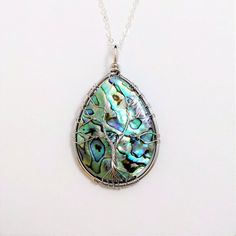 Abalone Shell Tree of Life Necklace / Green Blue Seashell / Silver Wire Wrapped Tree Pendant / Gift Bohemian Tree Of Life Round Jewelry, Handmade Teardrop Abalone Shell Jewelry, Unique Nickel-free Teardrop Necklaces, Handmade Spiritual Abalone Shell Jewelry, Abalone Shell Round Pendant Jewelry Gift, Bohemian Abalone Shell Pendant Jewelry, Abalone Shell Gemstone Jewelry Gift, Abalone Shell Necklaces With Natural Stones For Gifts, Tree Of Life Pendant Necklace As Gift