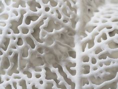 an intricate white piece of art made out of foam