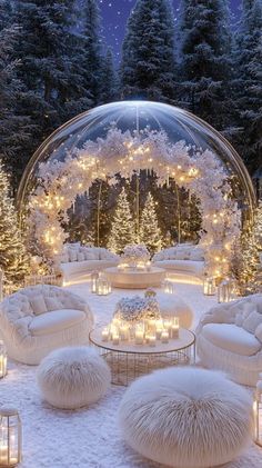 a living room filled with lots of white furniture and christmas lights on the trees in the background