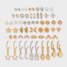 30-pair earring set from Wild Fable™ features a mix of celestial-themed stud and hoop earrings, all with gold or silver finishes. Includes assorted designs such as stars, moons and more. Made of nickel-free metal with post-back closures for comfortable and secure wear. If you’re not satisfied with any Target Owned Brand item, return it within one year with a receipt for an exchange or a refund. Wild Fable™: A look for every story. Celestial Style Pierced Earrings At Affordable Price, Cheap Hypoallergenic Celestial Earrings, Celestial Moon Earrings With Star Charm, Celestial Moon Charm Earrings, Celestial Gold-plated Earrings With Moon Charm, Earring Trends, Star Moon, Hoop Earring Sets, Piercing Ideas