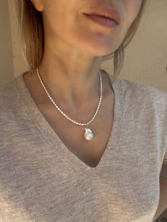 This baroque pearl pendant necklace is made of real fresh water pearls, including mini rice pearls that measure only around 2 mm. Both pearls are top AAA quality, with amazing lustre and color. This baroque pearl necklace is very versatile and elegant, you can easily add it to almost any outfit. Necklace length is 43 cm (17 inches). Customisation of length is possible, please contact me if you need it. Please note, that due to the natural origin of this product the shape of pearls might vary. If White Teardrop Pendant Pearl Necklace In Dainty Style, White Dainty Teardrop Pendant Pearl Necklace, Drop Pearl Pendant Necklace, Teardrop Pearl Necklace With Pearl Charm, Beaded Pearl Pendant Necklace, White Teardrop Pearl Necklace In Dainty Style, Dainty Teardrop Pearl Charm Necklace, Baroque Pearl Teardrop Pendant Necklace With Pearl Drop, Pearl Teardrop Pendant Necklace