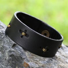 Men's ruggedly handsome black leather bracelet by Gill Quarcoopome. The masculine bracelet is adorned with a clever arrangement of crimped antique brass inserts which have been hand-stitched with leather cords creating a discreet contrast of powerful elegance. Leather Brass Inserts Snap clasp Avoid contact with water Handmade in & fairly traded from Ghana Modern Silver Jewelry, Diy Leather Bracelet, Leather Crafting, Silver Bracelets For Women, Black Leather Bracelet, Leather Wristbands, Wristband Bracelet, Printed Jewelry, Crochet Diy