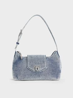 This product is made with at least 20% sustainable materials by weight. CHARLES & KEITH uses recycled, degradable, organic, and water-based materials in our eco-conscious collection. Embrace nostalgia fashion with this sleek baguette bag that is made with denim. It also comes in a unique washed finish that gives it an cool, edgy aesthetic. Coupled with a push-lock closure flap opening, the silver-toned accent adds a hint of shine while the zipped closure offers extra security. Thanks to its elongated and slouchy design, you will have plenty of room to hold your belongings. Nostalgia Fashion, Charles And Keith, Denim Bags, Edgy Aesthetic, Denim Belt, Latest Bags, Baguette Bag, Charles Keith, Denim Bag