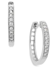 Take center stage in these channel-set hoop earrings. Crafted in 10k white gold with round-cut diamonds (1/6 ct. t.w.). Approximate diameter: 1/4 inch. Classic Diamond White Hoop Huggie Earrings, Classic Round Huggie Earrings With Diamond Accents, Classic Silver Huggie Earrings Channel Set, Classic Hoop Earrings With Diamond Accents, Classic Silver Channel Set Huggie Earrings, Elegant Macy's Hoop Earrings For Anniversary, Classic Round Hoop Earrings With Diamond Accents, Classic Round Diamond Earrings From Macy's, Classic Diamond Huggie Earrings