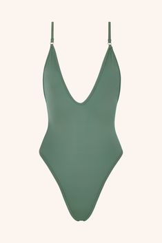 Shine bright in our iconic gold one-piece swimsuit. Designed with a bold plunging neckline and a radiant golden hue, this piece exudes confidence and glamour with every move. Whether you're lounging poolside or catching waves, this gold one-piece bathing suit is the ultimate style statement. Cut & Fit Shaping, sculpting fit Pulls on Plunging neckline High-cut style with medium coverage brief Hardware & Straps All gold hardware Adjustable shoulders straps Lining & Fabric Double-lined