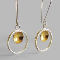 These elegant earrings will shine on your ears. Perfect as a gift or for yourself to add lots of sparkle to your style. Made of sterling silver and finished with 24k gold keum boo on the inside of the dome. Hammered sterling silver hoop. Measure: disc: 1/2″ or 11mm hoop: 1″ diameter. length: 2″ or 50mm Arrives to you in a gift box with foam padding and tissue paper. This item is a special made to order piece. Please allow me at least one week to complete your piece before it is shipped. If you n Gold Sterling Silver Circle Earrings, Gold Open Circle Sterling Silver Earrings, Gold Circle Earrings In Sterling Silver, Gold Sterling Silver Open Circle Earrings, Gold Sterling Silver Round Disc Earrings, Keum Boo, Hammered Sterling Silver, Shine On, Sterling Silver Hoops