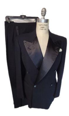 Here for your consideration is this beautiful Howards Clothes black vintage tuxedo. Comes with black huge silk lapels with the double pleated high rise trousers, just gorgeous.  If your looking for something special and elegant with quality here it is. Compliment your homberg, Chesterfield, and be ready for that special black tie party. Why rent when you can own this high-quality tuxedo. Elevate your style with this tresure of the past. Make this high-quality masterpiece a staple and part of you Tailored Black Double Breasted Suit For Evening, Luxury Fitted Double Breasted Suit For Party, Elegant Double Breasted Suit For Black-tie Events, Black Fitted Double Breasted Suit For Party, Fitted Black Double Breasted Suit For Party, Elegant Tailored Double-breasted Suit For Evening, Elegant Fitted Double Breasted Suit, Classic Black Suit For Black Tie Event, Black Tuxedo For Evening Occasions