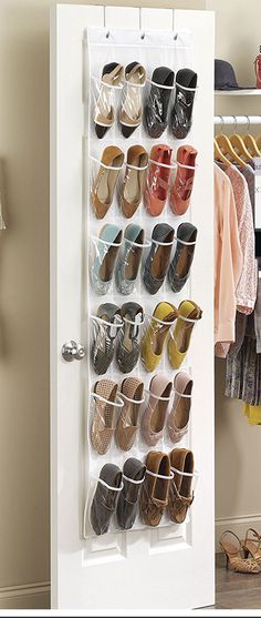 a white door with shoes hanging on it and an open shoe rack next to the door