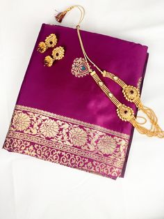 Create a symbol of beauty and elegance with our mesmorising Silk saree in magenta colour complimented with traditinal gold printed border. This gorgeous saree includes a matching unstitched blouse piece which is customisable to fit all sizes. If you require the blouse to be stiched, We offer tailor service on request with additional cost. please contact us for more info and we will be happy to help. 🥻Occasion: Party, Sangeet, Wedding, Engagement, Outings, Bridal & festival. 🚚 Shipping : We offer International fast shipping (Ask for more info) **Color may differ due to photography in light effect** Gold Banarasi Silk Set With Cutdana Details, Gold Banarasi Silk Sets With Cutdana, Bollywood Style Gold Banarasi Silk Set, Festive Gold Katan Silk Blouse Piece, Gold Banarasi Silk Bollywood Set, Semi-stitched Gold Banarasi Silk Set, Bollywood Style Gold Blouse Piece For Diwali, Gold Semi-stitched Blouse Piece With Pallu, Gold Anarkali Set With Dupatta For Traditional Ceremonies