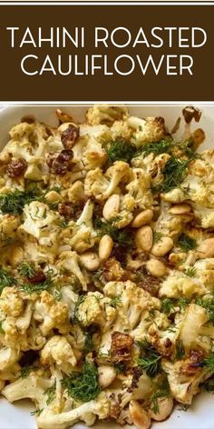 cauliflower with nuts and herbs in a white bowl on a wooden table, text reads tahn roasted cauliflower